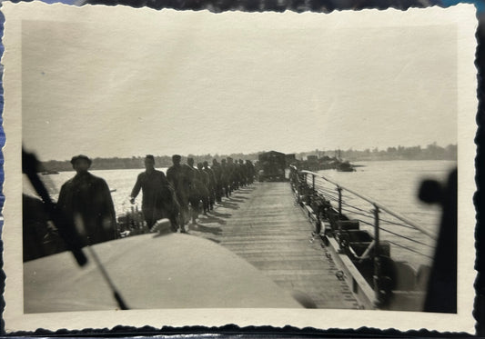 German WWII Photo Of Russian POW’s Walking Across Bridge